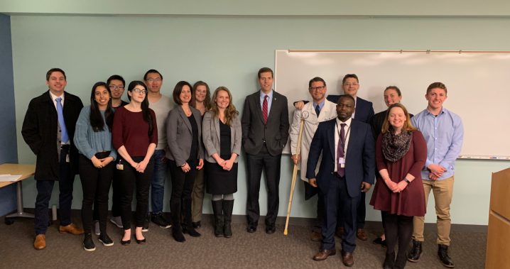 Group of students and researchers standing together with U.S. representative, Conor Lamb,  at the front of a classroom